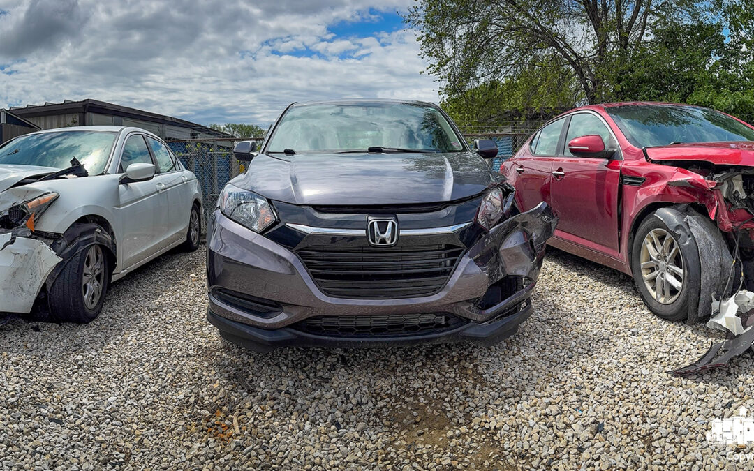 After cleaning out my totaled Honda Accord (left), I stepped back and noticed the other vehicle involved in the crash—a maroon Kia also destined for the scrapyard.. My Final Photo for May 5, 2025.
